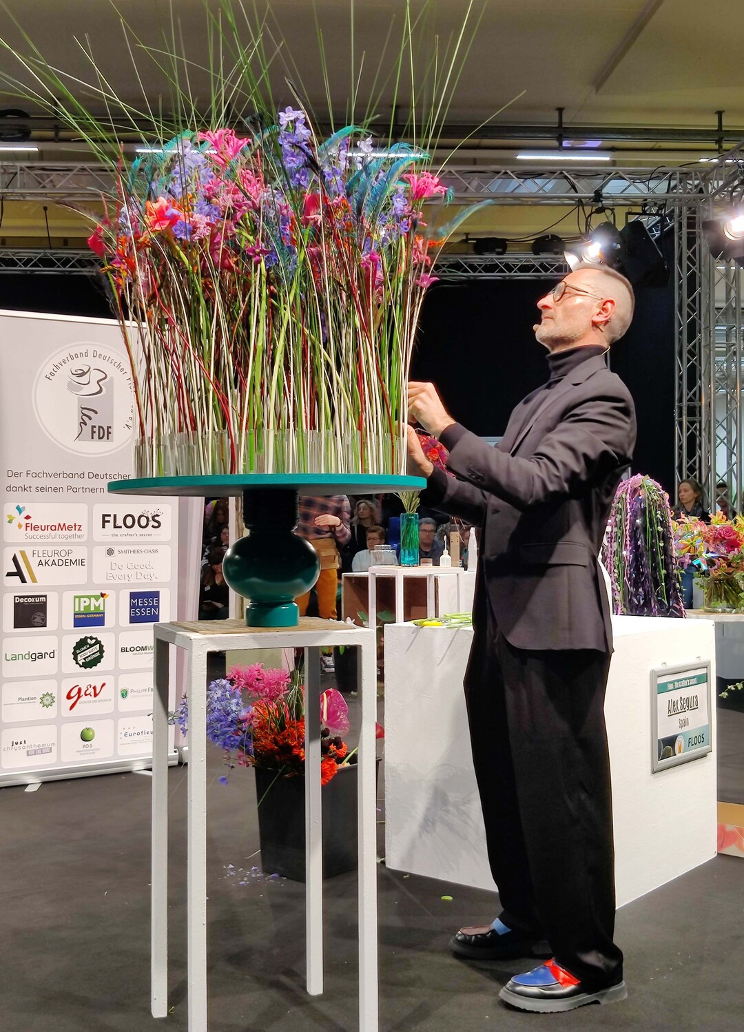 Alex Segura designs a room object with peacock feathers