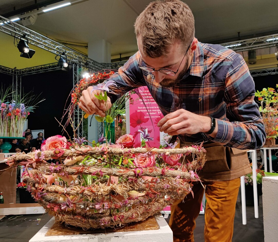 Max Hurtaud fills glass vases in a homemade bowl