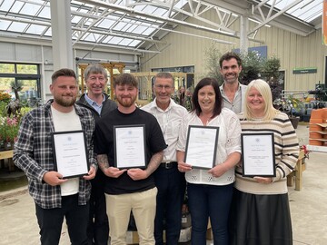 Staff at Cowells Garden Centre with their awards including one for North East Garden Centre of the Year in the Destination Garden Centre (DGC) category with (back row L-R) GCA CEO Peter Burks, GCA Inspector, Colin Farquahar and Area Chairman, Justin Williams.