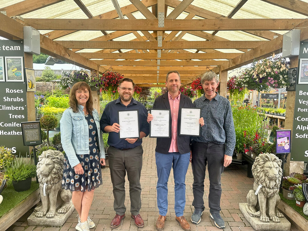 Matthew Bailey (right), General Manager at Mortonhall Garden Centre, which was awarded Garden Centre of the Year in the Destination Garden Centre (DGC) category for Scotland with GCA Inspector, Alyson Haywood (far left) and GCA CEO, Peter Burks (far right).